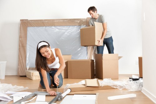 Moving van and packed boxes for removals in Haroldhill