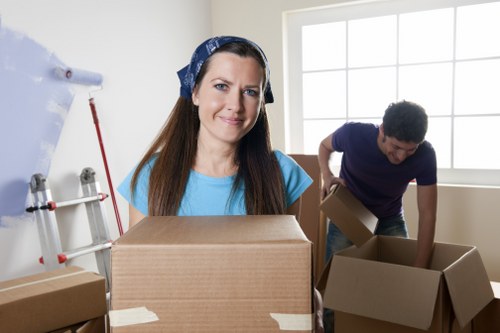 Removal workers carrying furniture during a house move in Haroldhill