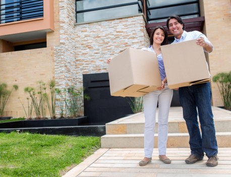 Professional movers packing fragile items in Haroldhill